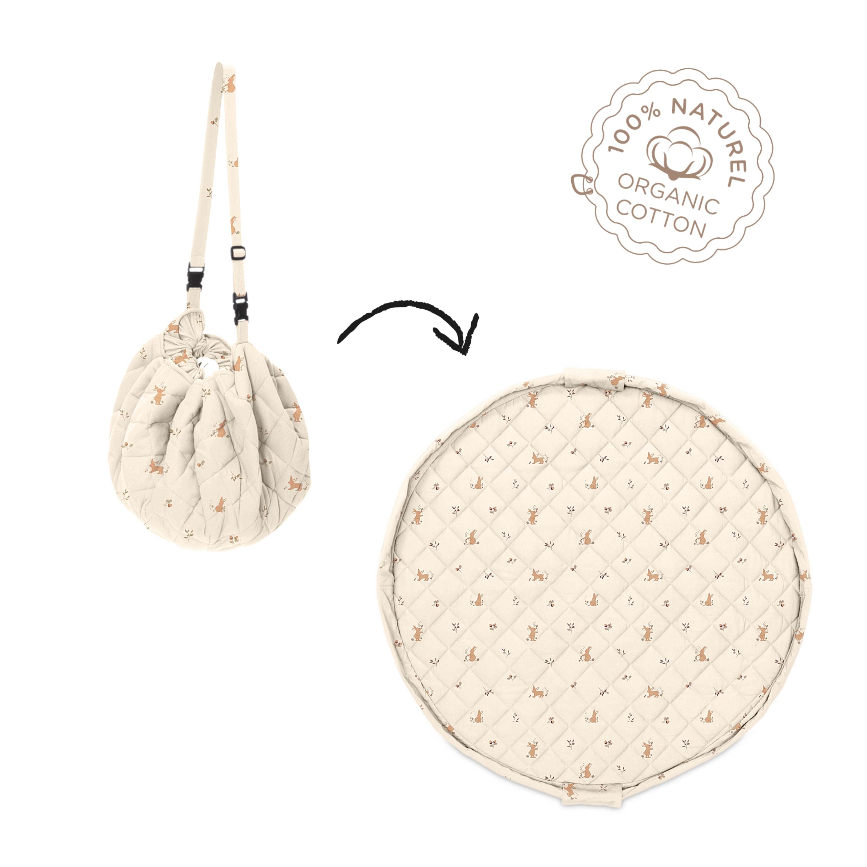 detail of soft organic rabbit babymat, label organic cotton, from bag to mat