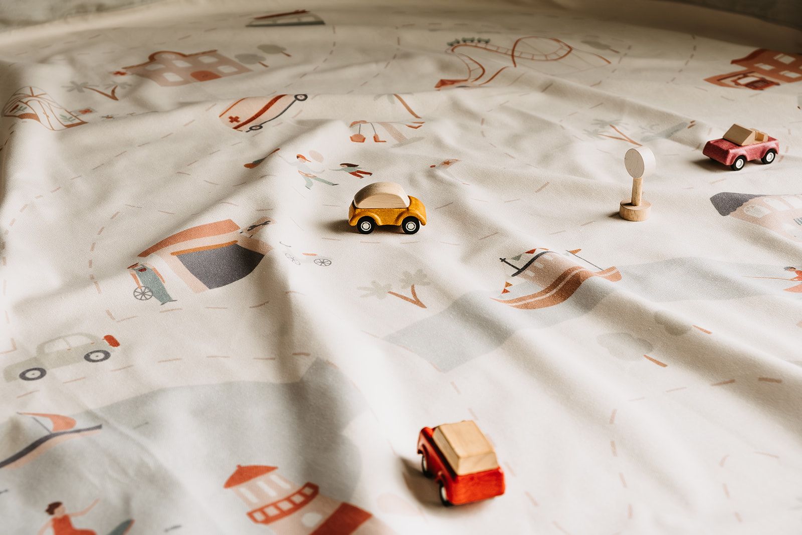 citymap toy storage bag and playmat, open mat with wooden toys