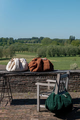 noomad soft teddy evergreen, brown and oak, closed bags standing outside