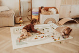 EEVAA farm puzzlemat, children are playing on the mat with wooden toys, kidsroom, doll in wooden basket, colored blocks placed on each other, a wooden slide