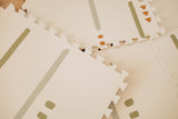 detail of EEVAA farm puzzlemat, back side print stripes and icons