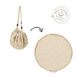 detail of soft organic stripes brown babymat, from bag to mat, label organic cotton