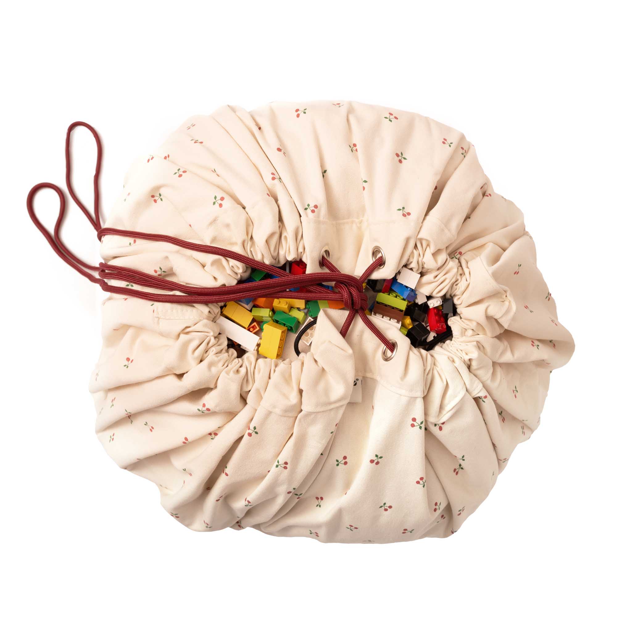 detail picture of cherry cherry toy storage bag, closed, filled with lego