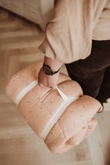 Bloom fleuri organic babymat, person carrying the mat