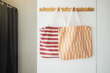 toto bear and toto bunny, hanging on coat rack on wall, transformed into bags