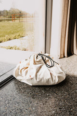 fairyworld toy storage bag and playmat, closed bag in front of the window