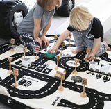 Play&Go roadmap/Thunderbolt Toy Storage Bag and play mat, kids playing on mat in kidsroom, wooden toys