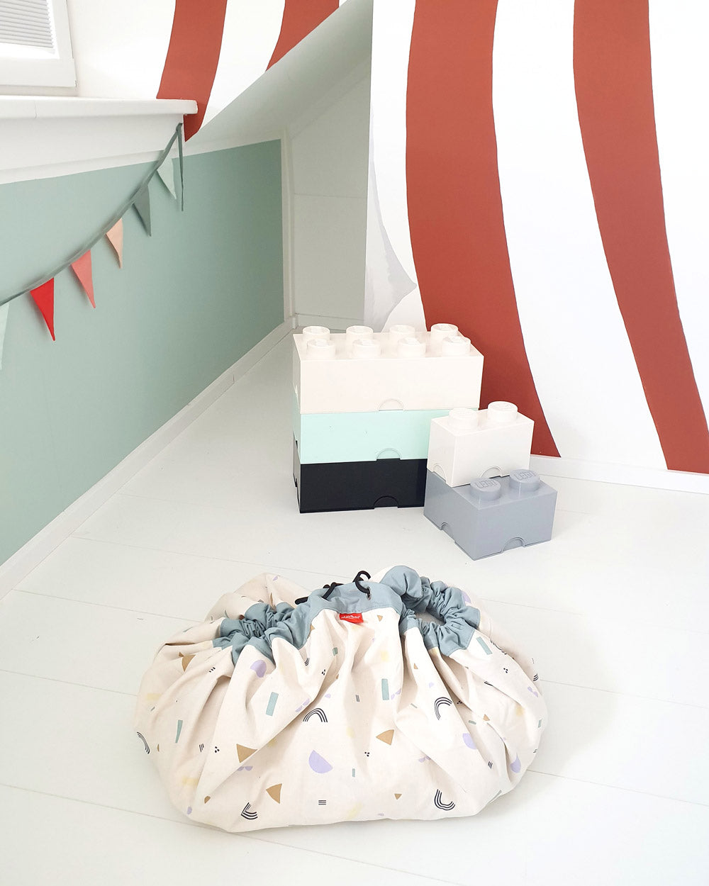 veggie number storage bag, closed on floor, kidsroom, circus tent painted on wall, flags
