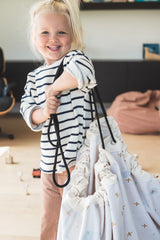 farm toy storage bag and play mat, child carrying closed bag, bird print