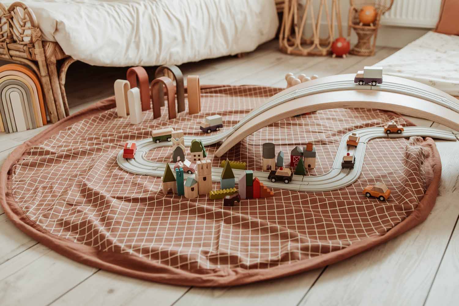 open organic grid brown storage bag, lots of wooden toys and a road, kidsroom