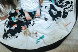worldmap/stars storage bag, children sitting on mat, lots of toys